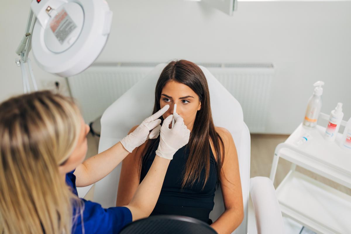 Woman getting nose job consultation