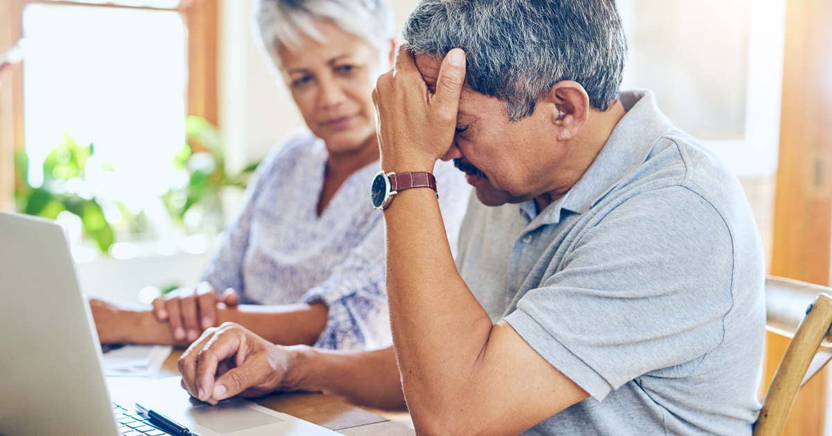 Frustrated couple looking online