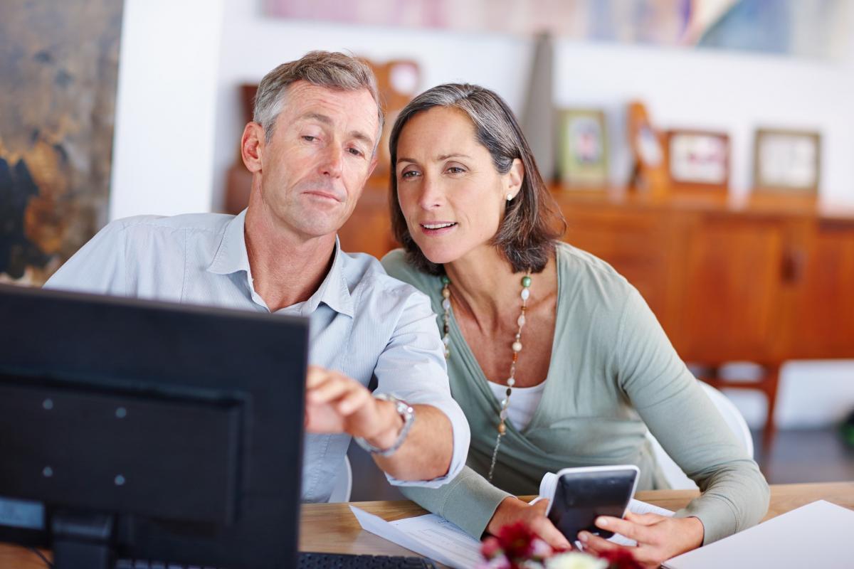 Couple looking at laptop