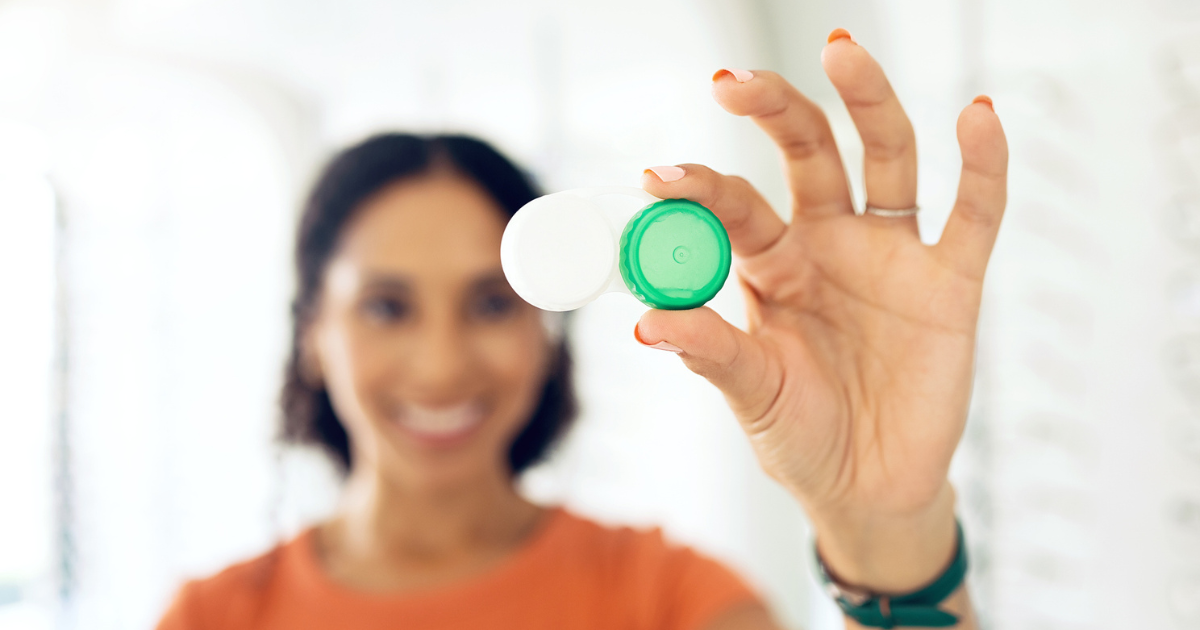 Woman holding contact lens case