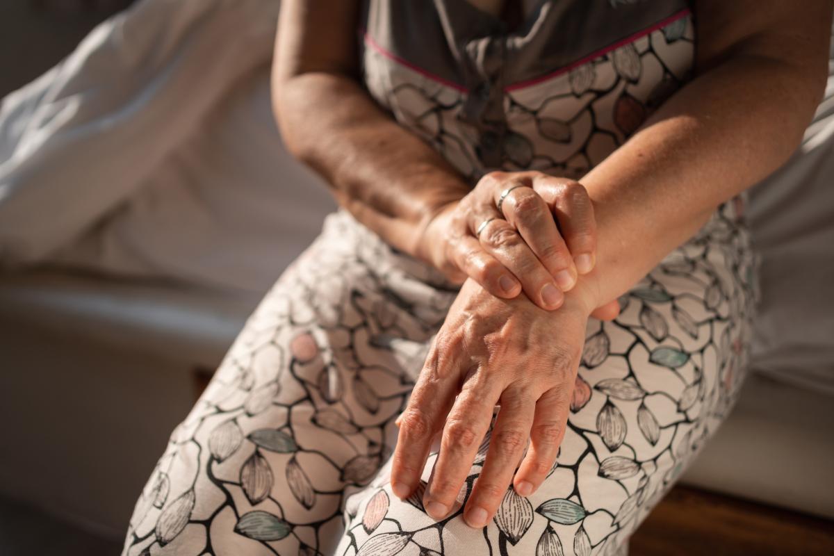 Woman holding her wrist