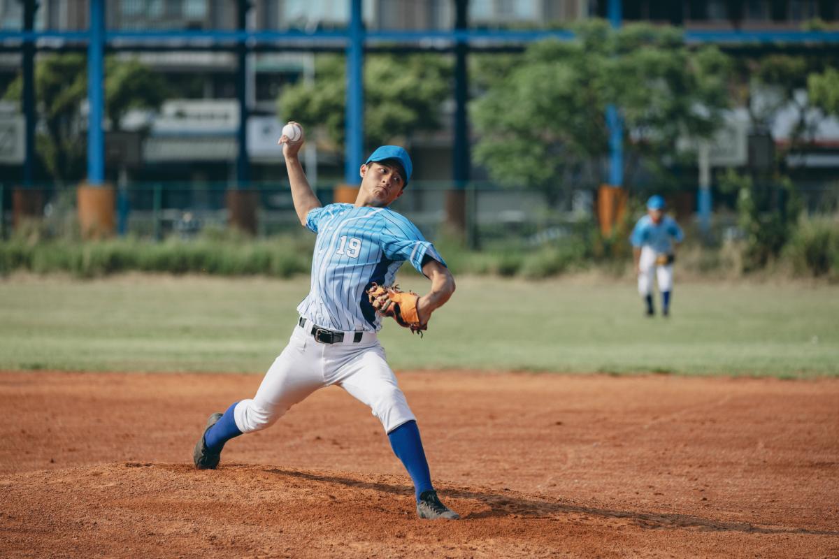 Teen boy pitching