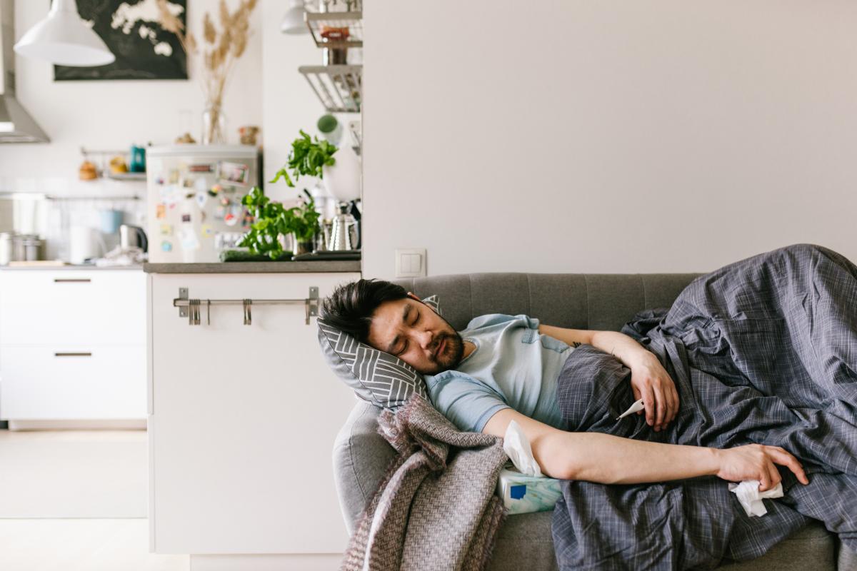 Man lying sick on the couch