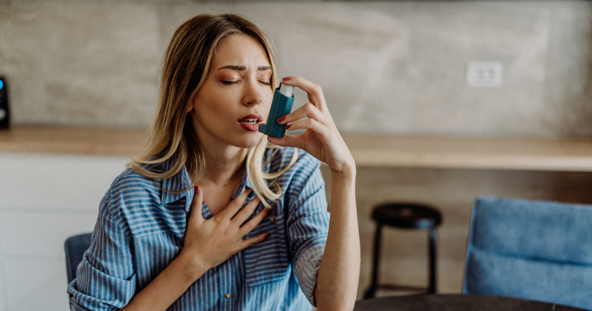 Woman using inhaler