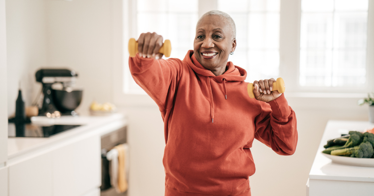 Woman with hand weights in her kitchen