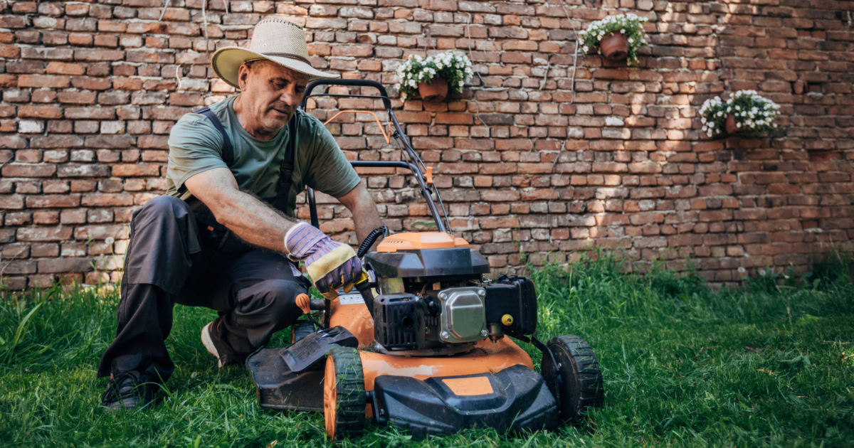Man working on a lawnmower