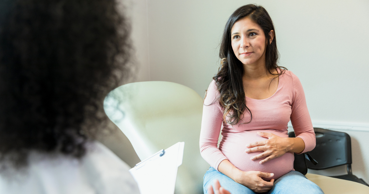 Pregnant woman sitting in doctor's office