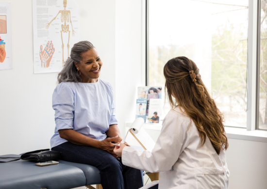 Older woman talking to her doctor