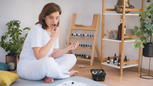 Woman smelling essential oil