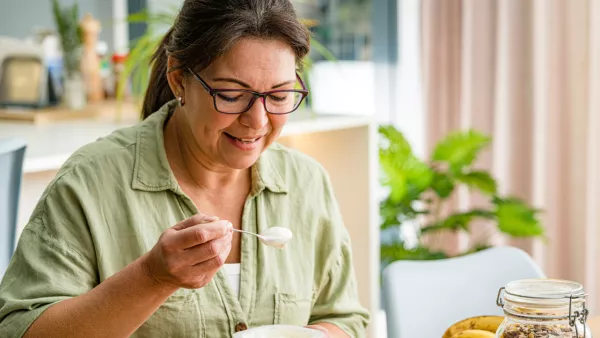 Woman eating yogurt