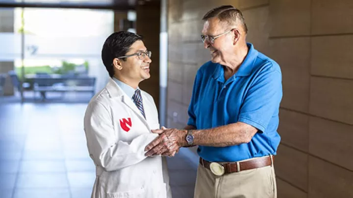 Vijaya Bhatt, MBBS, hematologist and medical oncologist, and Steve Waller, cancer survivor, visit following a check-up more than two years after Waller received a clean bill health.