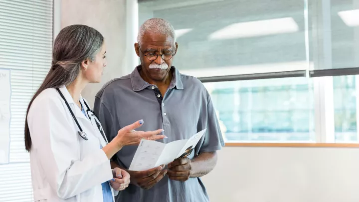 Older man talking to a doctor