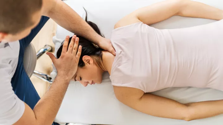 Woman being adjusted by a chiropractor