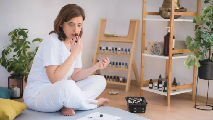 Woman smelling essential oil