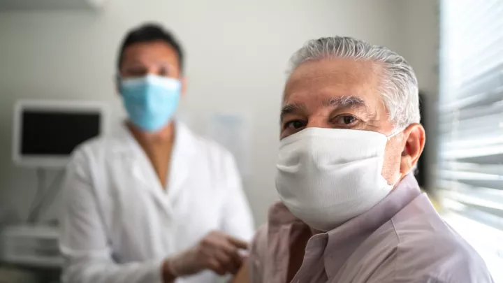 Man and doctor wearing masks