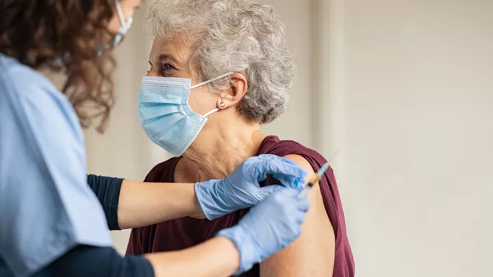 Older woman getting vaccine