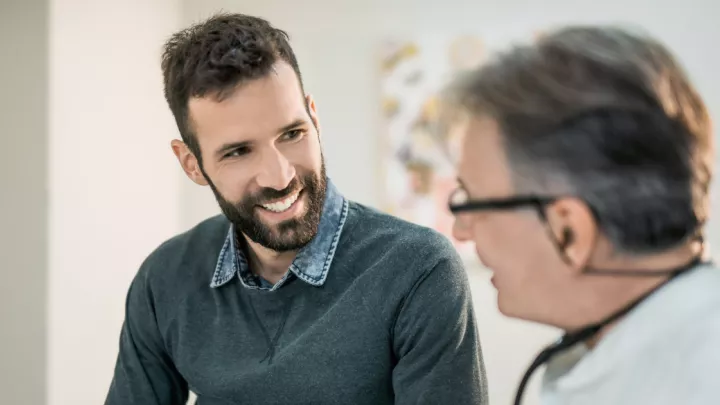 Man talking to doctor