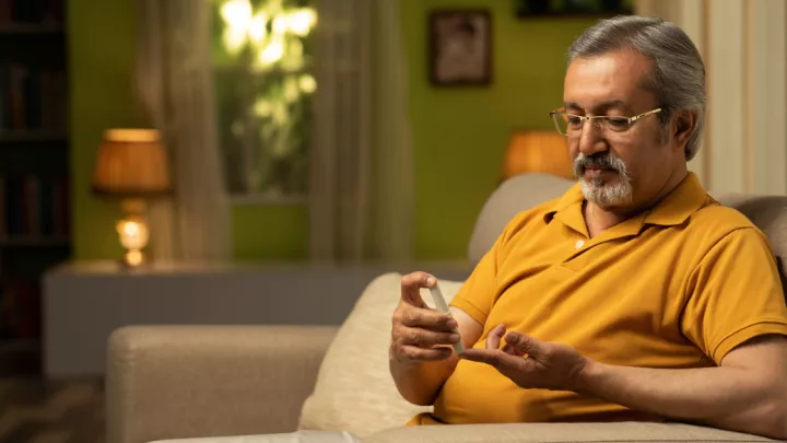 Man checking his blood sugar