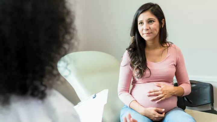 Pregnant woman sitting in doctor's office